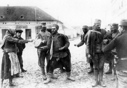 Serb prisoners buy bread, 1915 (b/w photo)