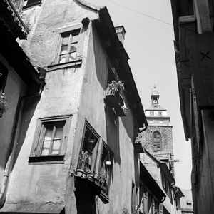 View through a lane in an old city to a belfry, Germany 1930s- (b/w photo)