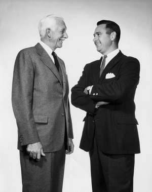Close-up of two businessmen smiling