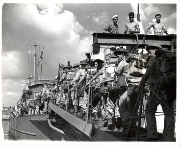 Troops of the 8th Army going aboard a landing craft, c.1939-45