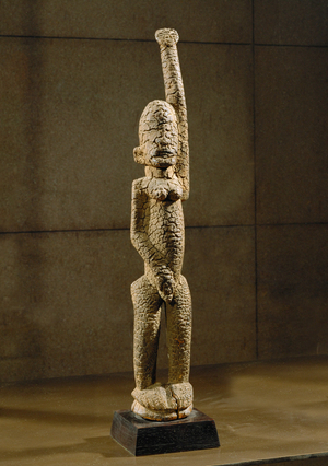 Female figure with raised left arm …