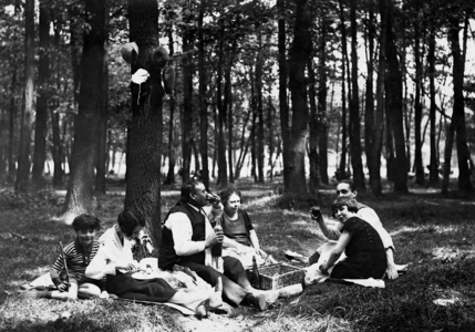 Family picnic in the woods (b/w photo)