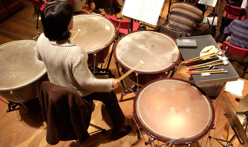 Aerial view of timpanist and timpani.
