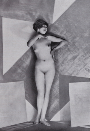 Posed portrait of a female nude (b/w photo)