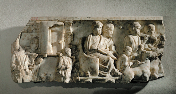 Side of a sarcophagus: a magistrate's progress, his official entrance into a town