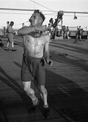 Jenner Jones, playing deck tennis, 3rd County of London Yeomanry (Sharpshooters) on board HMT Orion en route to Egypt, 1941 (b/w photo)
