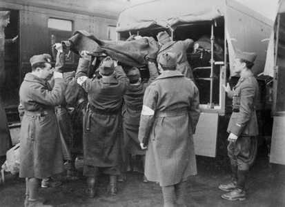 Boarding injured people in medical cars on the French front, 1940 (b/w photo)