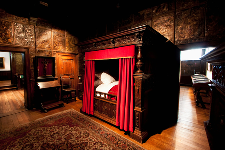 Carved oak four-poster bed in the bedroom of the Plantin-Moretus House-Workshops-Museum, Antwerp, Belgium (photo)