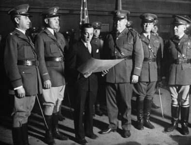 Buster Keaton with members of the National Guard, 1928 (b/w photo)