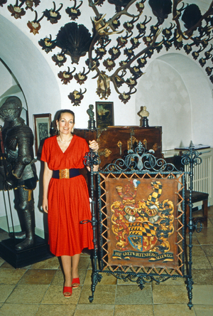 Diane Duchess of Wurttemberg with the family's coat of arms at Altshausen castle, Germany 1983