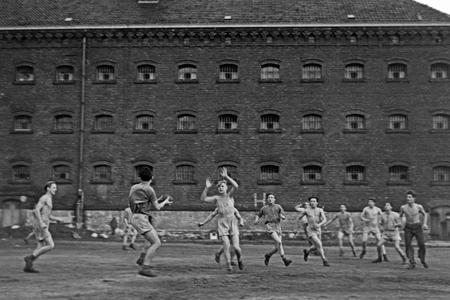 Original caption: Day's best hour is teh gym lesson at the prison yard, where it's not wild enough for the boys - Sports and exercises are done here, Germany 1950