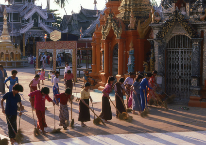 Burma / Myanmar: Temple sweepers at dusk, Shwedagon Pagoda, Yangon (Rangoon)