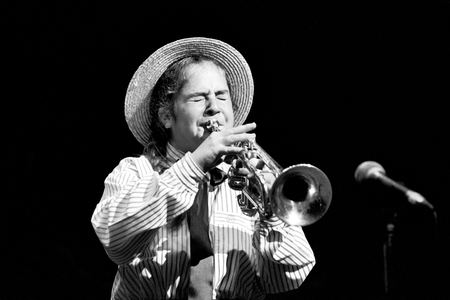 Teenage girl in school uniform playing the trumpet