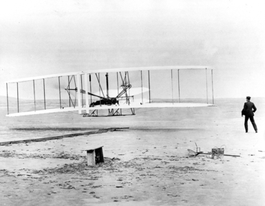 The first flight of Orville and Wilbur Wright with an aircraft engine, 1903 (b/w photo)