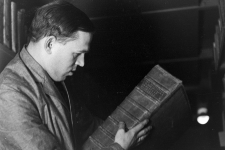 Staff members in their daily business with collections and items for international library lending service at Deutsche Staatsbibliothe library at Berlin Unter den Linden, Germany 1930s (b/w photo)