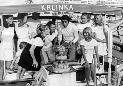 Claude Bourg, Joan De Kat, Enrico Macias With A Cake, on The Boat Called Kalinka. Cannes, France, July 30, 1968 (b/w photo)