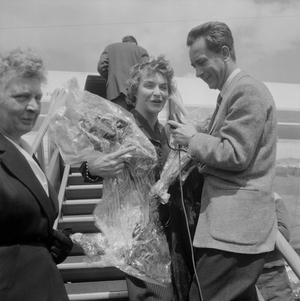 French singer, actress and revue leader Line Renaud stepping off the plane at Orly airport after her triumphant tour in the United States (USA), on May 1, 1955