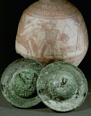 Lyre player on a painted jar from Megiddo, in the foreground a pair of bronze cymbals (ceramic)