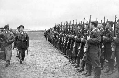 Adolf Hitler strides with Hermann Goering in front of Air Force soldiers (b/w photo)