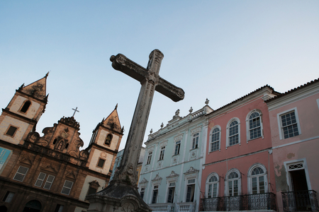 The church of San Francisco and a crucifix monument in Largo Cruziero de San Fancisco, in the Pelourinho historic centre, Salvador, Bahia, Brazil (photo)