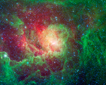 Swirling dust clouds and bright newborn stars dominate the view in this image of the Lagoon nebula from NASA's Spitzer Space Telescope.
