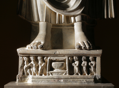 Detail of base on Schist stone Gandhara figure of Buddha wearing flowing robes in Rob…, 2015 (photo)