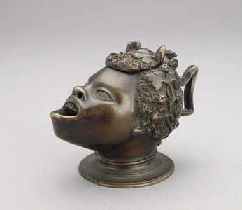 Lamp (or inkwell) in the form of the head of an African boy; hinged lid and angular handle, c. 1510-30 (bronze)