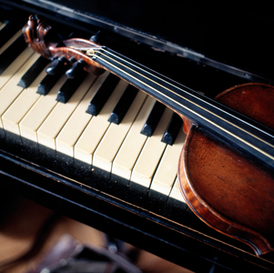Violin lying on piano