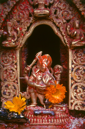 Nepal: Small metal statue of the Hindu god Shiva in a roadside shrine in Kathmandu, Kathmandu Valley