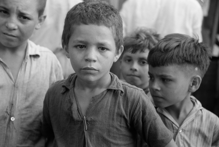 Children begging for pennies at the market in Rio Piedras, Puerto Rico, 1942 (b/w photo)