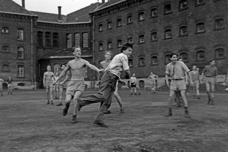 Inmates of the prison are doing some ballsport in their free time, correctional faciltity Herford Germany 1950