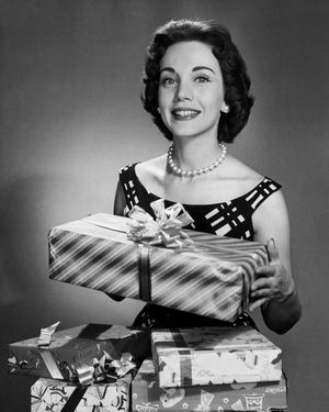 Mid adult woman holding a gift