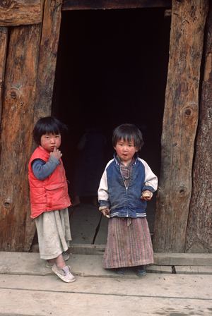 Young Bhutanese children in Wangdiphodrang village, Bhutan, Himalayas (photo)