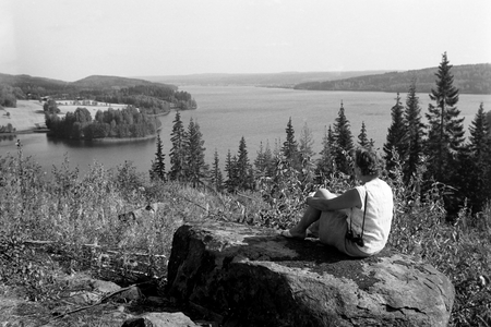 A woman is having a look over the landscape, Östra Örten Sweden 1969