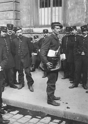 A soldier as mailman in Paris, 1906 (b/w photo)
