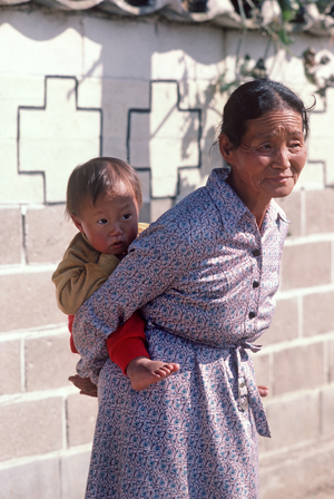 Grandmother with child in typical South Korean village, South Korea, Asia (photo)