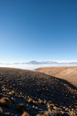 Andean Peaks & Salar De Alconcha Salt Pan Covered By Fog (photo)