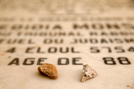 Jewish cemetery of Fes, Morocco, Stones on a rabbi's tomb (photo)