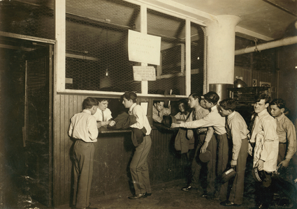 Messenger boys turning in their uniforms at the main office of the Postal Telegraph Co. in New York City, 1910 (b/w photo)