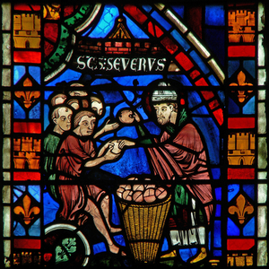 Window w51 depicting St Sever distributes food to the poor (stained glass)