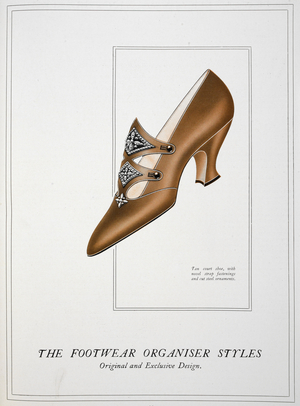 Tan court shoe, with novel strap fastenings and cut steel ornaments'.