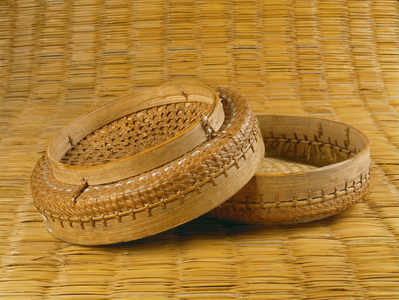 Small bamboo baskets of this shape are typical of the south-east region of Trimshing and are used as food container and plate