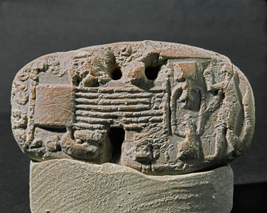 Man at a weaving loom …