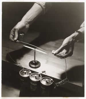 Garage Man Filling Up Storage Battery (gelatin silver print)