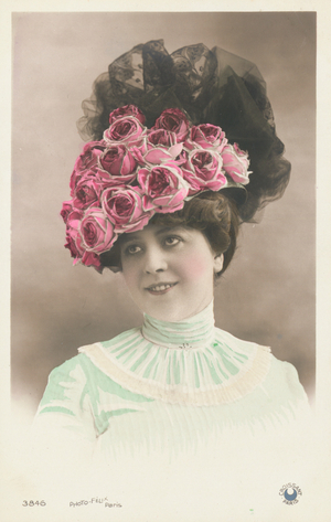 Portrait of a woman wearing a hat covered with flowers (photo)
