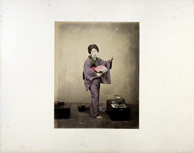Woman with fan, 19th century (hand-coloured b/w photo)