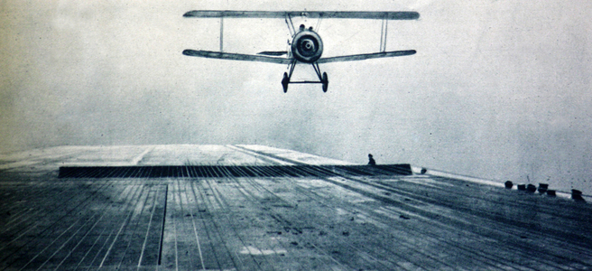 Aeroplane about to make a landing on the deck of H.M.S. Argus