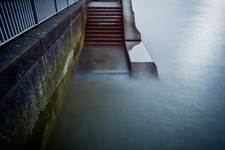 Steps down from the Southbank promenade to the River Thames, London, England, UK  (photo)