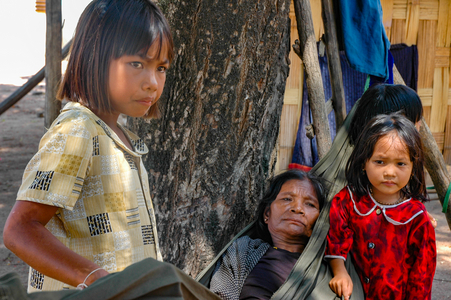 Cham culture: Old woman with young Cham girls, village near Phan Rang, Vietnam.