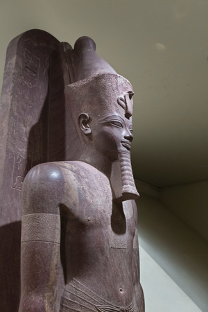 Amenhotep III standing upon the sled of Tem, Luxor statue cache (stone)